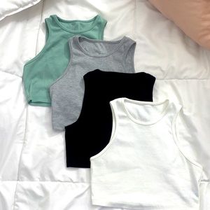 set of four cropped tees from shein in black, white, gray, and sage green